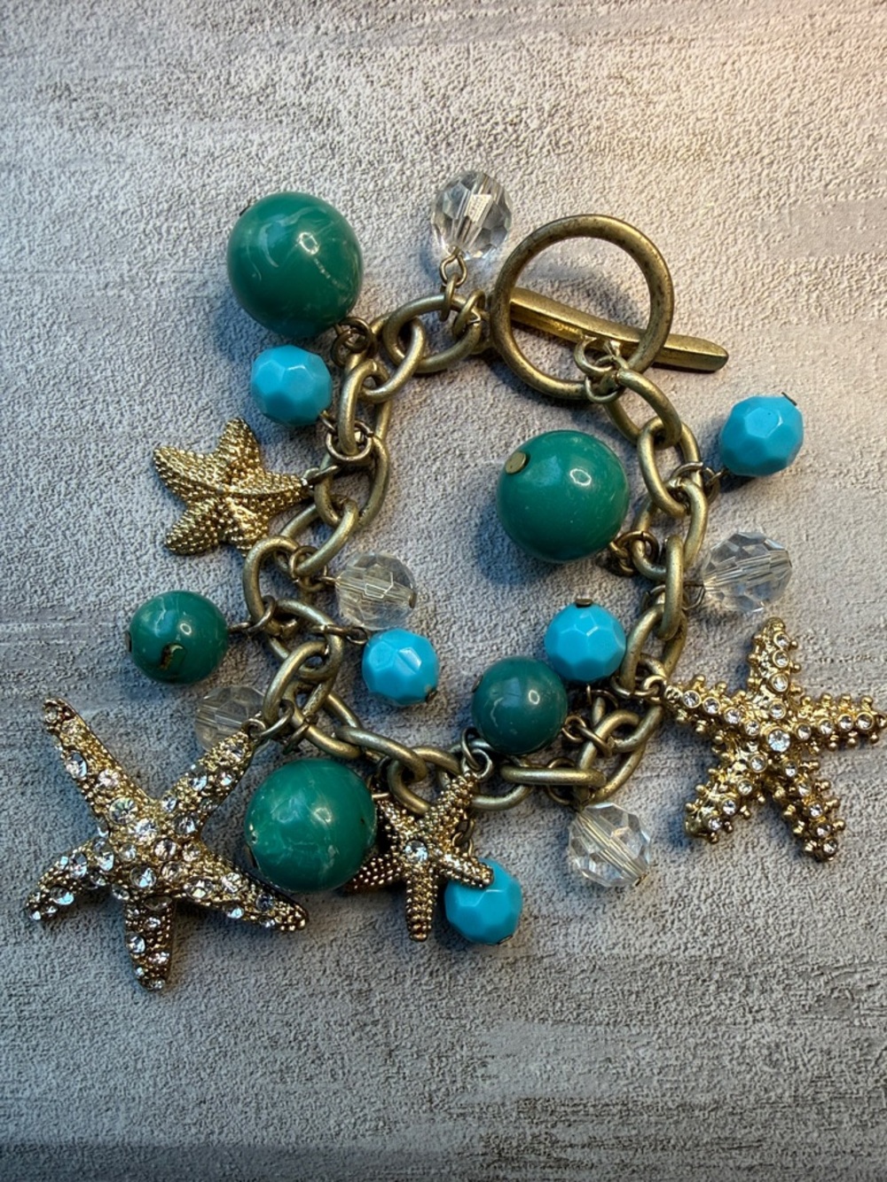 Gold-Tone Sea Star Charm Bracelet with Acrylic Turquoise and Teal Beads
